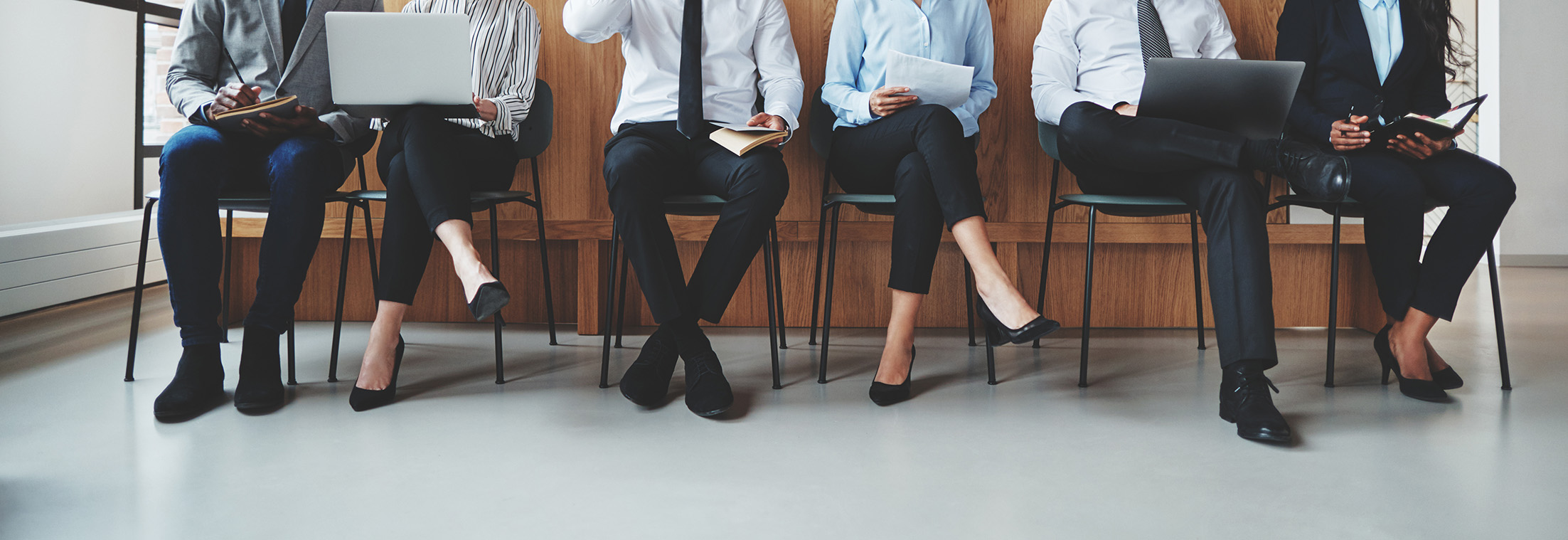 diverse-group-of-businesspeople-sitting-together - tinified